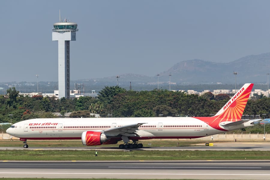 Air India 777 — Taxiing out past the tower, VOBL · Bengaluru — aviation photography by Mach One Aviation