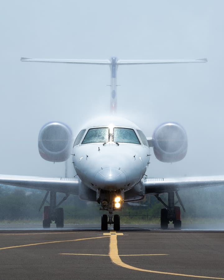 Star Air ERJ 145 — Water cannon salute, VOBL · Bengaluru — aviation photography by Mach One Aviation